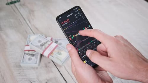 Hands Check Crypto Stocks on Mobile Device