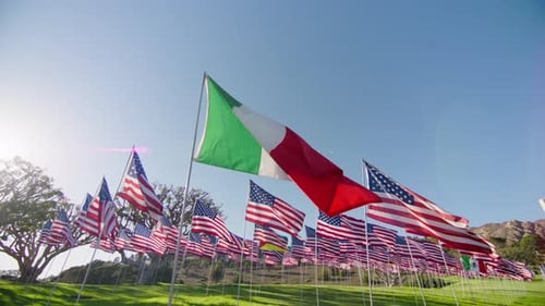 American and Italian Flags Waving in Sunny Breeze