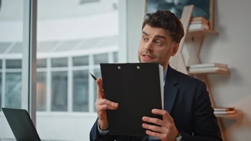 Professional Consultant Reading Document with Woman Client at Office Closeup