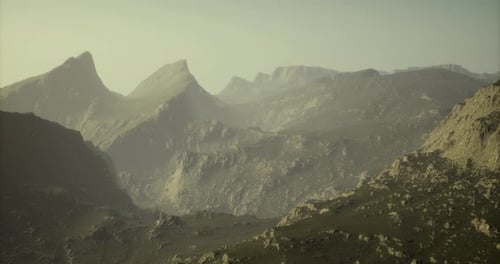 Cinematic Flight Over Rugged Mountain Range