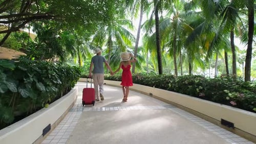Happy Family Holiday Young Traveler Woman Man Walking with Suitcase at Luxury Tropical Island Phuket