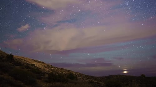 Night Sky Timelapse with Stars and Passing Clouds