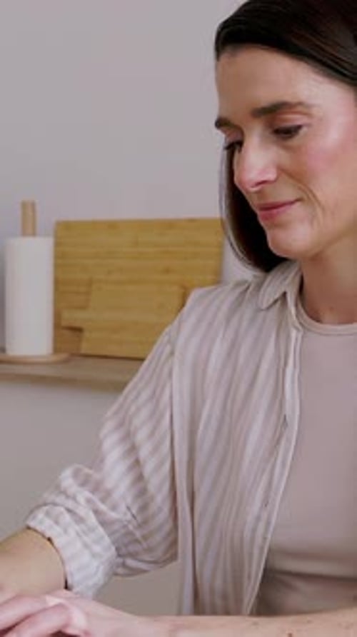 Woman Working on Laptop at Home During the Day