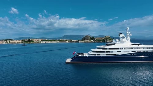 An aerial view captures the majestic Al Mirqab yacht, its sleek design