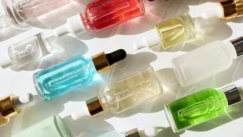 Assortment of Colorful Cosmetic and Skincare Bottles