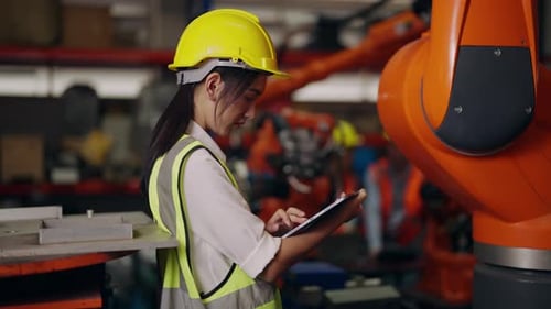 Female Industrial Engineer Worker Holding Tablet Working at Warehouse