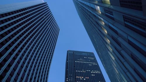 Low Angle Gliding Shot of Skyscrapers in the Tokyo. Financial District. Skyscape and Cityscape in t