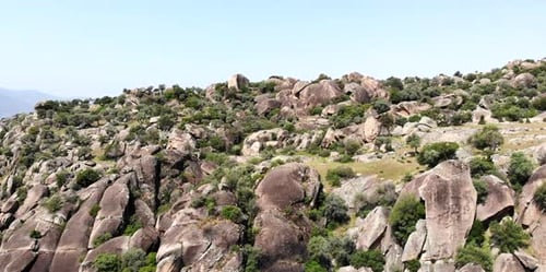 Rocky Hillside with Lake View