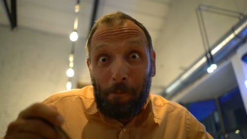 Funny, Hungry Man Eating Food in Cafe 30s