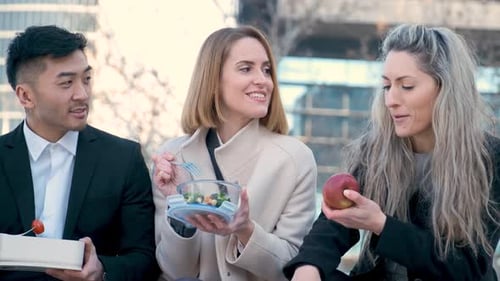 Businesspeople on Lunch Break Talk Relax and Laugh Outside Office Building