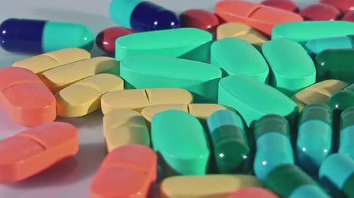 Pile of Colorful Pills and Capsules Close Up