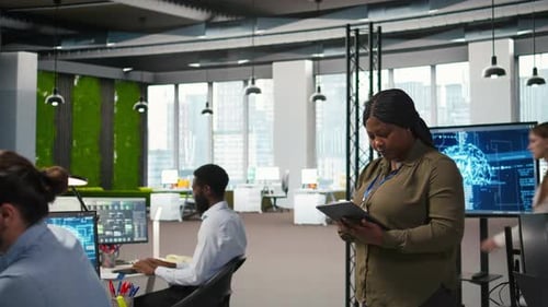 Happy Female Engineer in Office Automating Repetitive Tasks Using AI Scripts