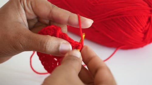 Hand Close Up Crocheting with a Hook Wool Yarn Creative Craft