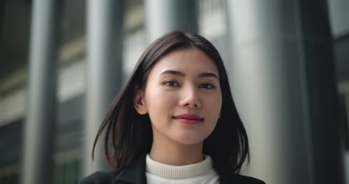 Confident Young Woman in Urban Business Setting