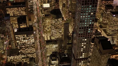A Stunning View of a City at Nighttime From Above with Vibrant Lights and Modern Buildings