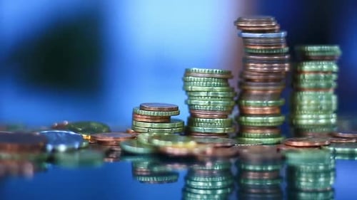 Stacks of Coins Show Growth and Savings