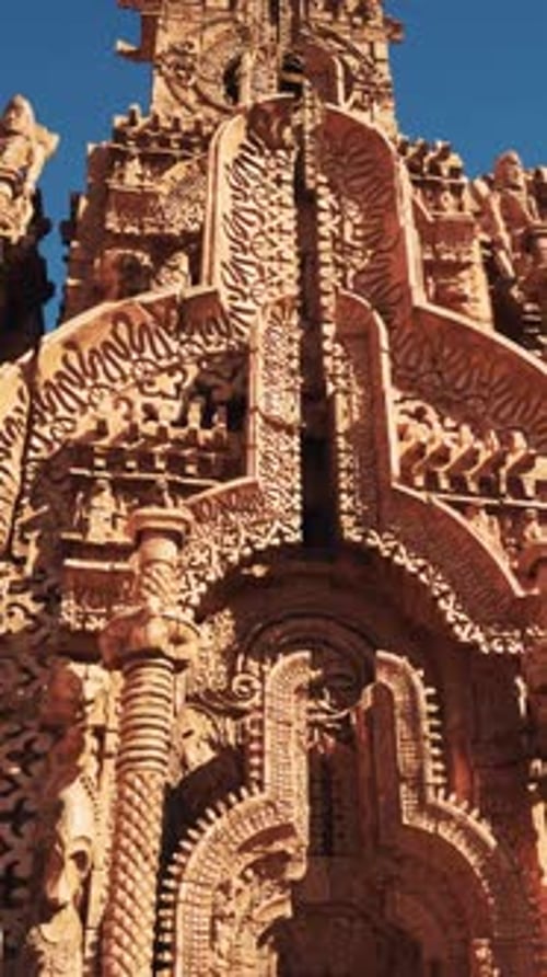 An Intricately Decorated Temple Wall Adorned with Statues