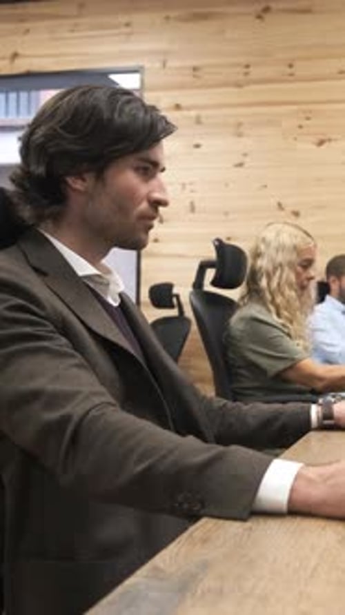 Businessman Slowly Turning Head in Office Vertical Footage
