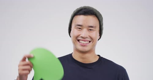 Smiling Man Holding Speech Bubble with Message