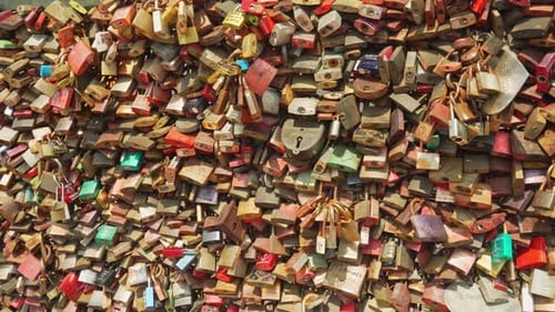 The bridge railings are densely hung with love locks. Millions of love locks hang