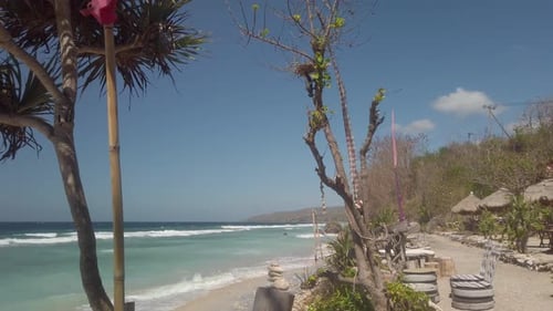 Beautiful white sandy beach and blue ocean in Bali Indonesia, Nusa Penida exotic island. Palm trees