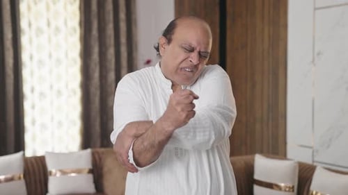 Senior Man with Elbow Pain