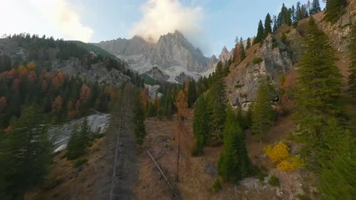 Aerial View of High Mountain Range with Clouds in Dolomites Italy