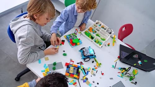 Robotics Programming Class Children Construct and Code Robot STEM Education Using Constructor Blocks