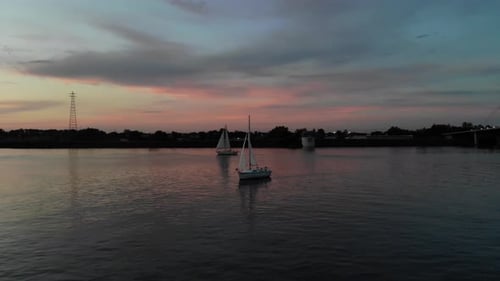 Aerial tracking shot of a traditional sailing boat on the upper Columbia river.
