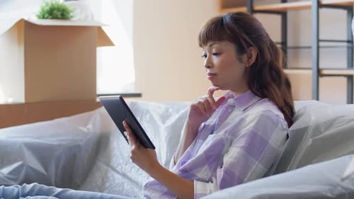 Moving, People and Real Estate Concept - Happy Smiling Asian Woman With