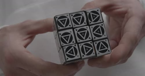 Hands Solving Puzzle Cube