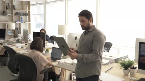 Business Owner Using Digital Tablet in Creative Studio Adult