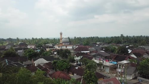 AERIAL 4K Flying Over Indonesian Village With Large Mosque in View