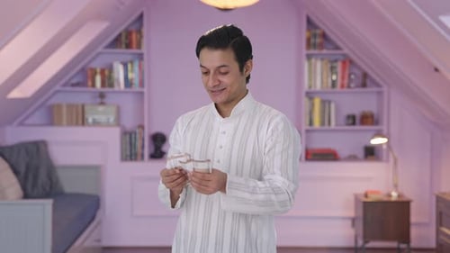 Man Counts Money Indoors