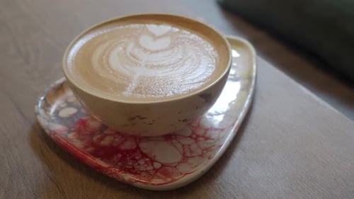 Enjoying Coffee in a Cozy Setting at a Local Cafe