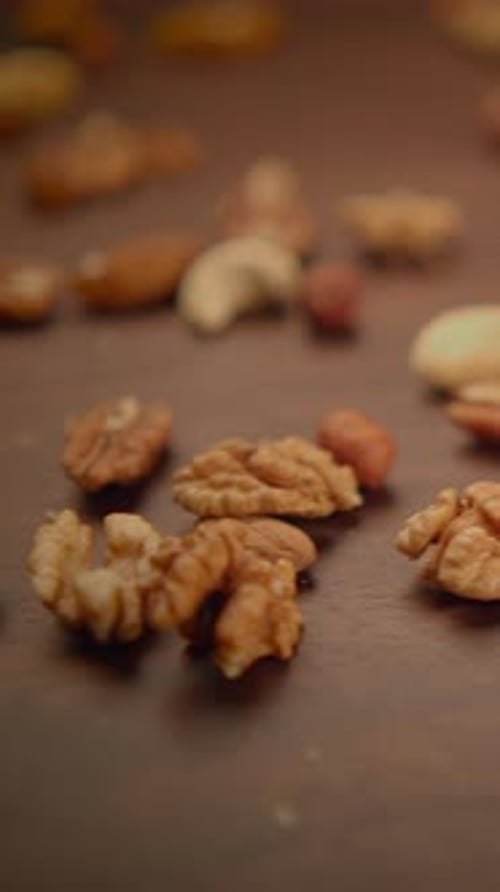 Close Up of Mixed Nuts on Wooden Surface