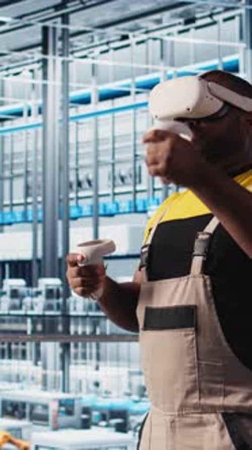 Vertical Video Smart Factory Engineer Using VR Headset to Oversee Operation of Robotic Arms
