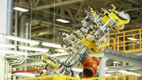 Robotic Arm Moving in a Modern Factory