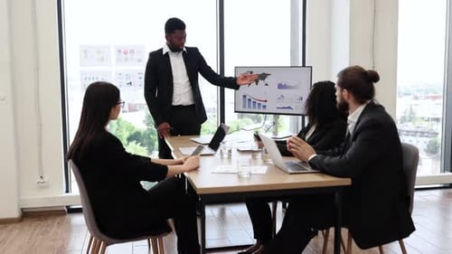 Diverse Team Meeting in Modern Office Setting