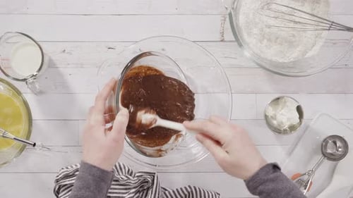 Mixing Chocolate Brownie Batter in Glass Bowl