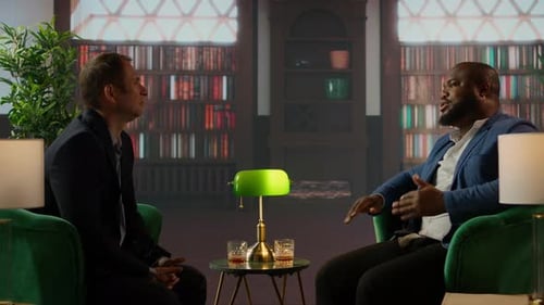 Men Discuss Business in Library over Drinks