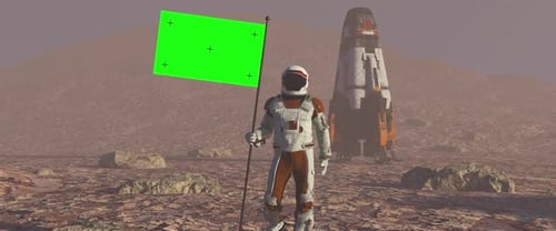 Astronaut Walking on the Mars with Green Screen Flag