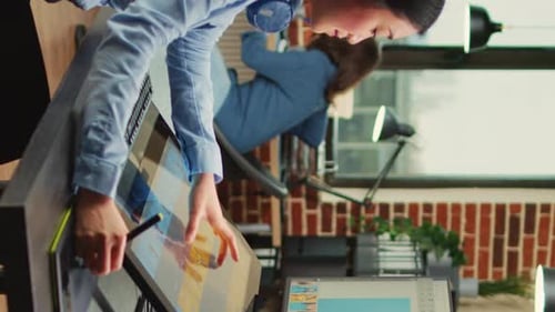 Artist Drawing on Tablet in Modern Office