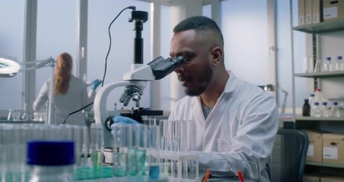 Scientist Using Microscope in a Modern Laboratory
