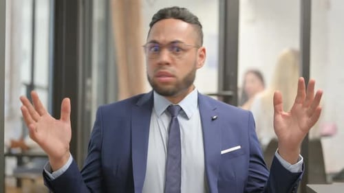Man in Suit Reacts With Shock
