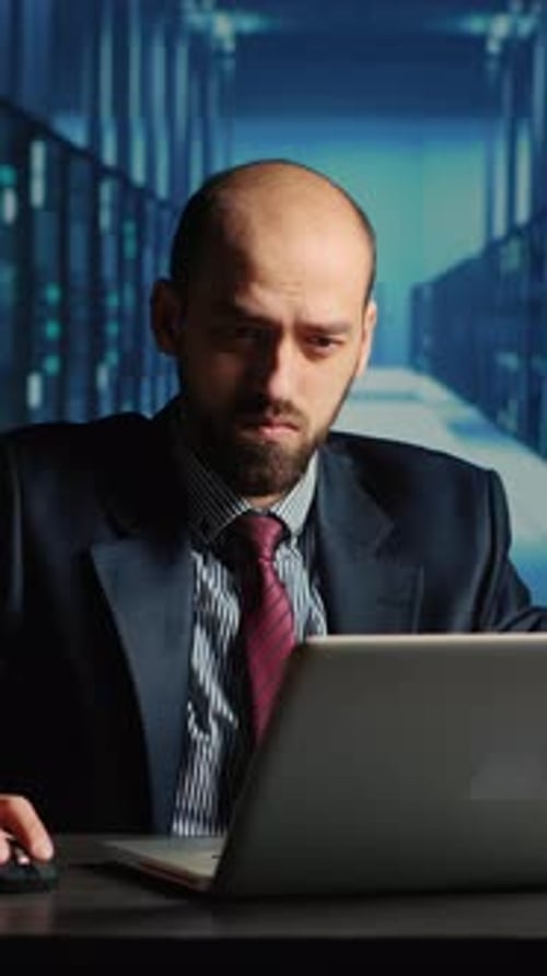 Vertical Video Data Center Technician Feeling Tired Working in Server Room