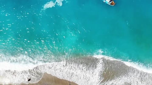 Stunning Aerial View of Turquoise Ocean and Sandy Shoreline