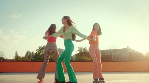 Friends Enjoying Roller Skating on Rooftop in Retro Style