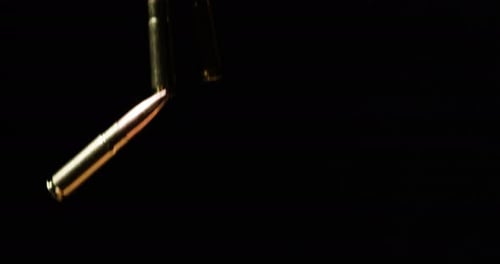 Falling 7.6235mm Intermediate cartridge With 9mm Bullets In Slow Motion.