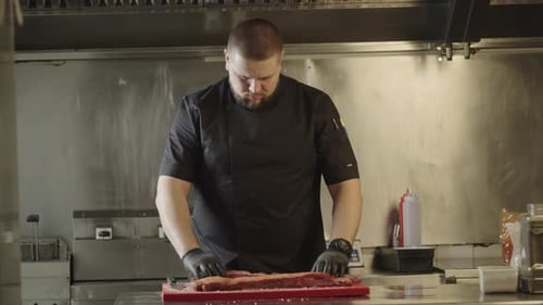 The Chef Prepares Raw Meat for Grilling